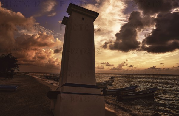 Puerto Morelos sunset lighthouse in Mayan Riviera Maya of Mexico