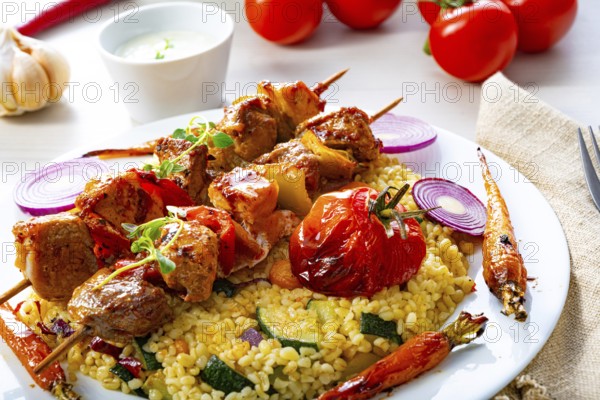 Kebabs with vegetables and bulgur