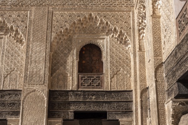 Fes, Morocco, April 05, 2023, Traditional oriental facade at the courtyard of madrasa Bou Inaniya in the medina of Fes, Morocco, Africa