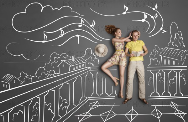 Love story concept of a romantic couple with different interests on holiday against chalk drawings background. Male listening to music in headphones and reading a book, female trying to attract his attention