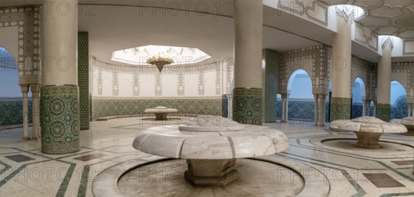 Casablanca, Morocco, 29 March, 2024: marble-carved lotus flower spring fountains in the underground bathhouse of the Hassan II Mosque in Casablanca, Africa