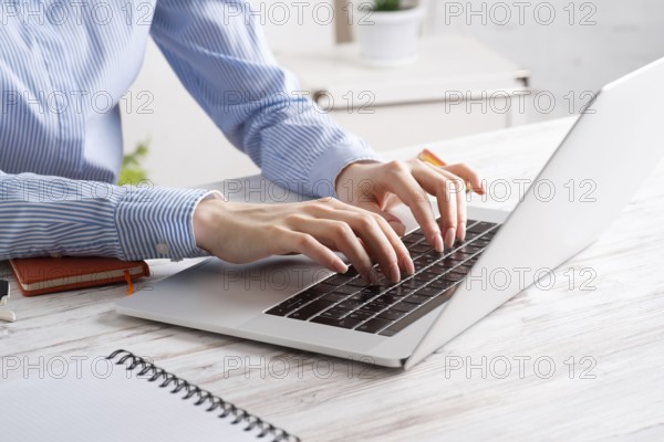 Office manager working with laptop. Corporate office workplace with computer. Business occupation concept with business woman at vintage wooden desk. Career development and success