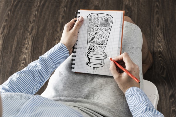 Close-up, woman draws business notes in her notebook. Business Innovation Concept