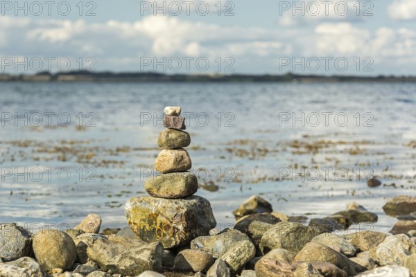Scenic spiritual stone tower at the seashore