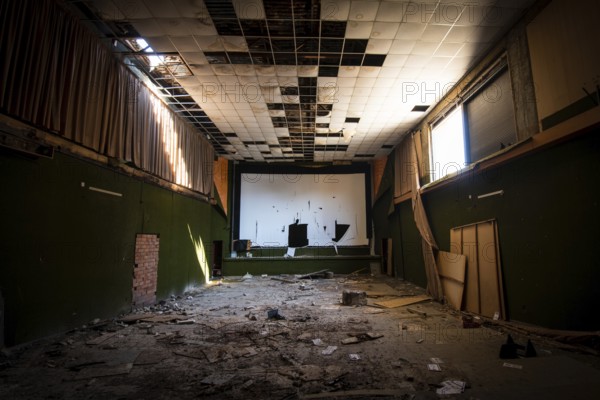 Abandoned and damaged interior of a stage theatre with bright light entering the building, Nicosia Cyprus