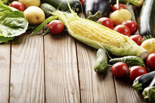 Fresh Organic Vegetable Food Ingredients on Wooden kitchen table background. Space for text