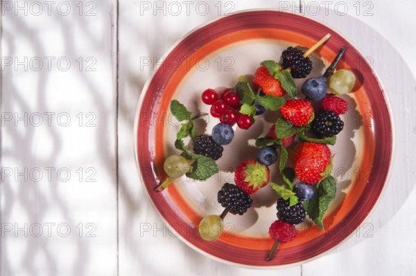 Presentation set of skewers of berries, summer dish