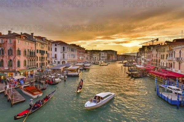 The Grand Canal with gondola and vaporetto at sunset time, Venice, Italy, Europe