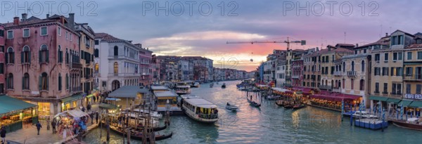 The Grand Canal with gondola and vaporetto at sunset time, Venice, Italy, Europe