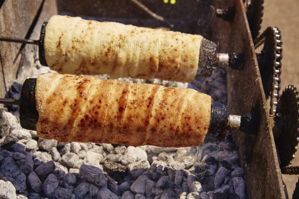 Rolled bakery meat rolls in charcoal bar-b-cue