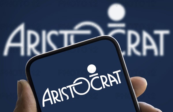 Aristocrat Leisure logo is displayed on smartphone. Aristocrat Leisure Limited is an Australian gambling machine manufacturer company.