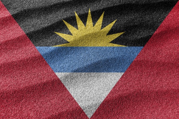 Antigua and Barbuda sand flag, national flag sand background