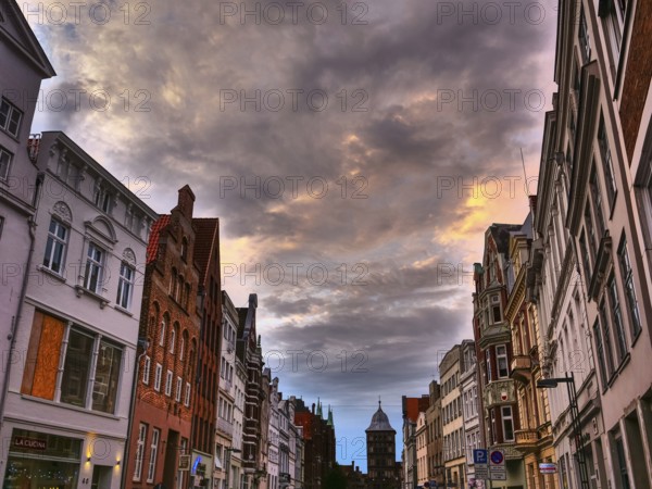 A historic old town with old buildings under a dramatically cloudy sky, Lübeck, Baltic Sea, Germany, Europe