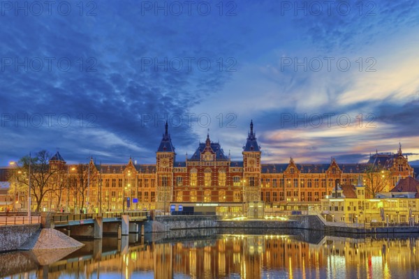 Amsterdam Netherlands, night city skyline at Amsterdam Central Station