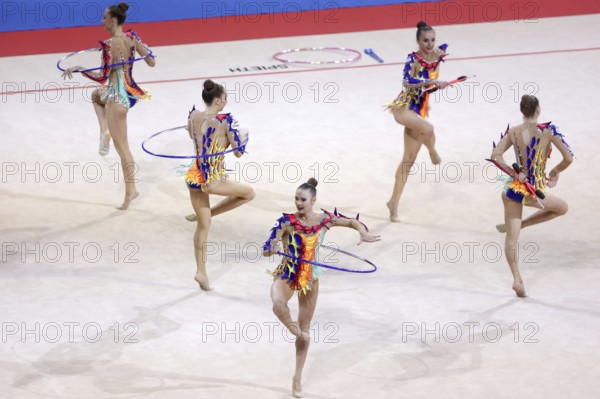 Sofia, Bulgaria - 27 March, 2021: Team Belarus perform during the 3 Hoops + 2 pairs of Clubs group qualifications at the 2021 Rhythmic Gymnastics Sofia World Cup, Sofia, Bulgaria, Europe