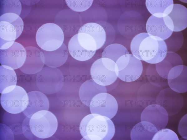Purple abstract background with bokeh defocused lights. Soft blurred yellow and gold bokeh background, Abstract lights. Defocusing lens