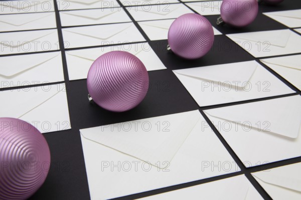 Christmas decoration with envelopes and purple balls. Christmas composition