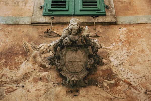 Classic outdoor bas-relief. Ancient statue on the walls of the old town of Kotor, in Montenegro