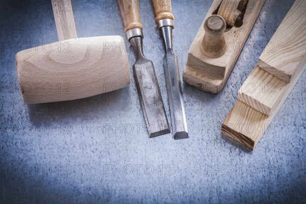 Composition of joiner's tools on metallic background construction concept