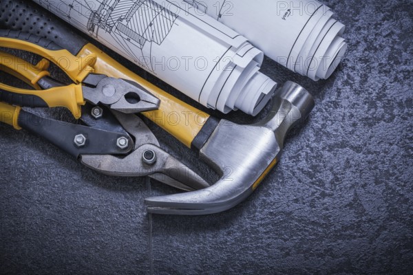 Construction drawings steel cutter pliers claw hammer on black background