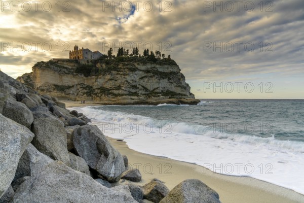 Tropea, Italy, 16 December, 2023: view of the Santa Maria dell'Isola Church on its rocky promontory in Tropea at sunset, Europe