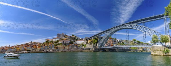 Panorama of the riverbank of Ribeira District and Dom Luis I Bridge in Porto, Portugal, Europe