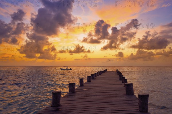 Riviera Maya pier sunrise in Caribbean Mayan Mexico