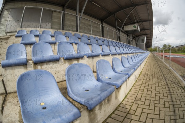 Blue seats in a sports stadium