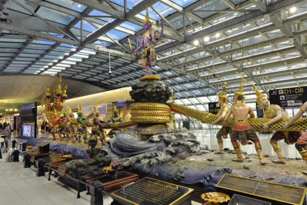 Group of figures from Thai mythology Scene of the Churning of the Milk Ocean in the departure area of Bangkok Suvarnabhumi Airport, Bangkok, Thailand, Asia