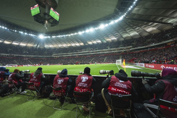WARSAW, POLAND - NOVEMBER 17, 2023: Qualifications for UEFA Euro 2024. Match Poland - Czech Republic 1:1. Photographers behind touche line of the field