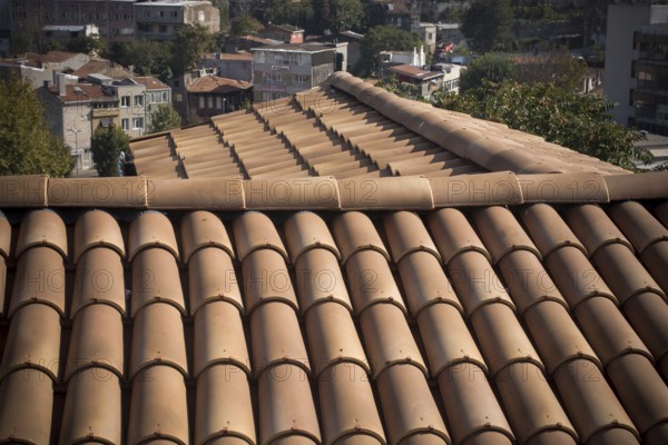 Tiles on old castle roof, architecture background. Brown roof tiles