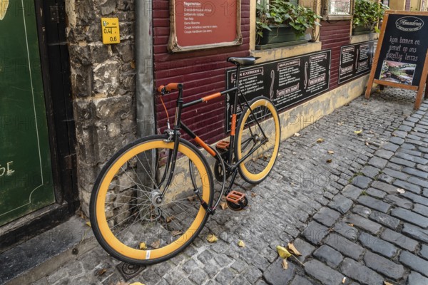 Ghent, Belgium, July 31, 2016: Picturesque restaurant with bicycles parked and flowers in Ghent, Europe