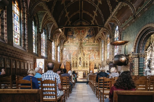 Bruges, Belgium, July 29, 2016: Interior view of Basilica of The Holy Blood of Bruges. The historic city centre is a World Heritage Site of UNESCO. It is known for his picturesque cobbled lanes and dreamy canals, Europe