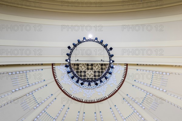 View to the ceiling of a building with modern chandelier and geometric patterns, Prague, Railway station, Historical