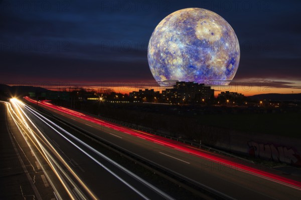 Surreal night sky with a huge moon over a town and traces of light from cars on the motorway at sunset, Mercury, photomontage, Kaiseraugst, Canton Aarau, Switzerland, Europe