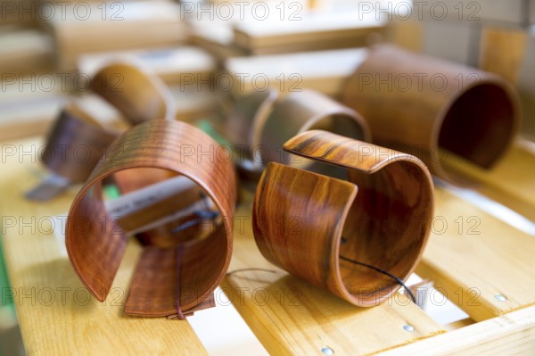 Handmade Wooden bracelets on wooden background. Dark wood