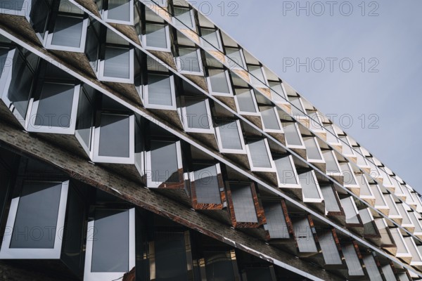 Photo of modern futuristic architecture with metal and glass window patterns