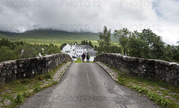 Unrecognised people walking at the bridge of orchy in Argyll and Bute in the central highlands of Scotland, United Kingdom, Europe