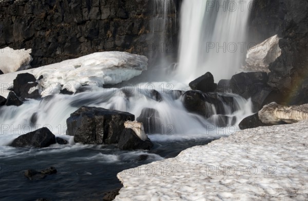 Water from waterfall splashing on a rocky river. The Oxararfoss waterfall in pingvellir Thingvellir national Park iceland