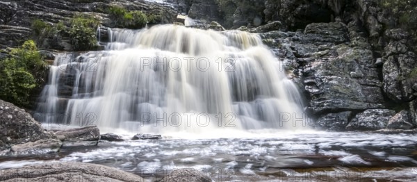 Close-up of a waterfall with water motion blur and pond, Caraca natural park, Minas Gerais, Brazil, South America