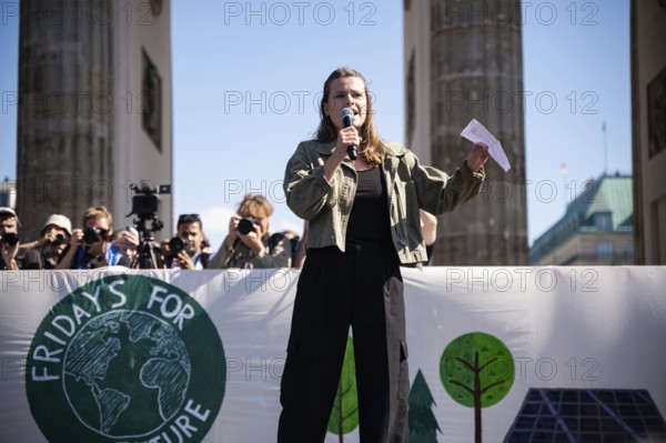 15/09/2023, Berlin, Germany, Europe, German climate protection activist Luisa Neubauer during her speech on a stage in front of the Brandenburg Tor in Berlin's Mitte district at the global climate strike organised by the Fridays for Future movement under the motto, Europe