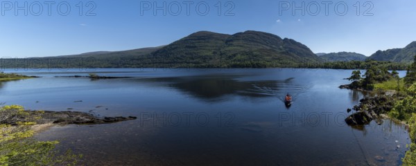 Muckross, Ireland, 10 August, 2022: tourists enjoy a boat ride on Muckross Lake in Killarney National Park on a beautiful summer day, Europe
