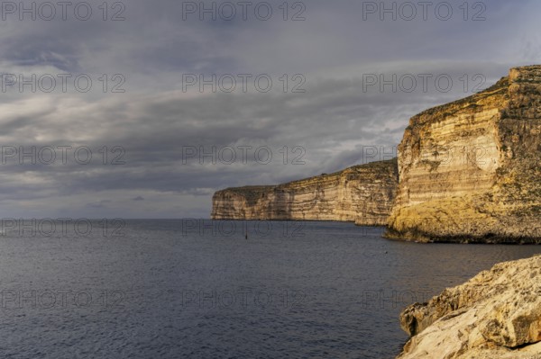 A view of the Xlendi Bay cliffs on the coast of Gozo Island in Malta