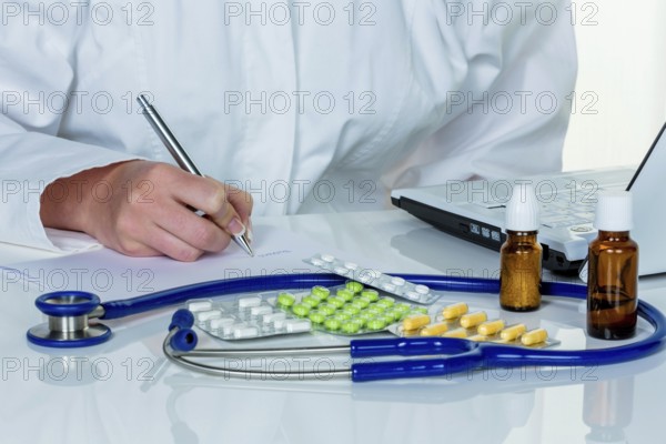 A young doctor prescribes medication. Prescription tablets are prescribed by the doctor. Austria