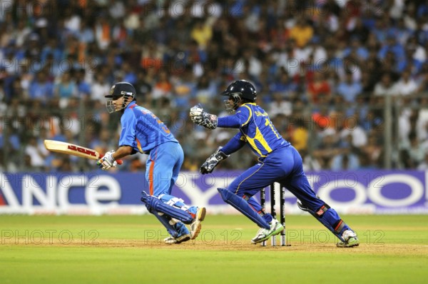 Batsman Gautam Gambhir plays shot Sri Lankan wicketkeeper Sangakkara tries ball 2011 ICC World Cup Final Wankhede Stadium