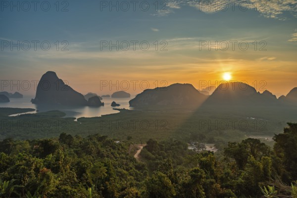 Tropical islands sunrise view at Samed Nang Chee viewpoint with bay to sea ocean, Phang Nga Thailand nature landscape