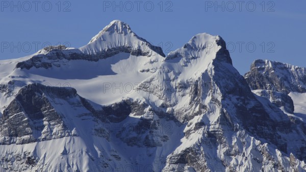 Snow covered peak of mount Uri Rotstock, Swiss Alps