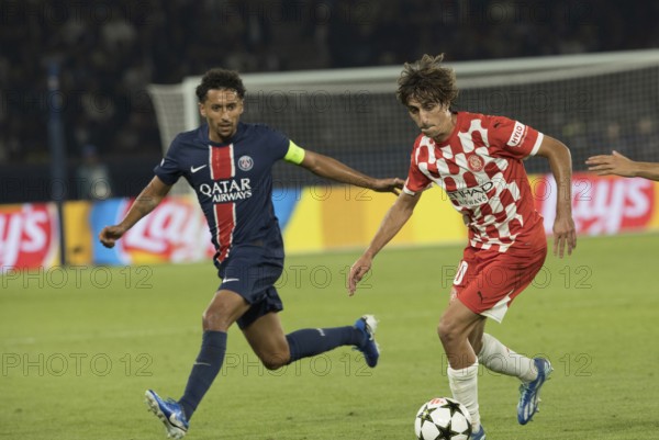 Football match, Bryan GIL Girona FC right on the ball fighting with MARQUINHOS Paris St. Germain, Parc des Princes football stadium, Paris