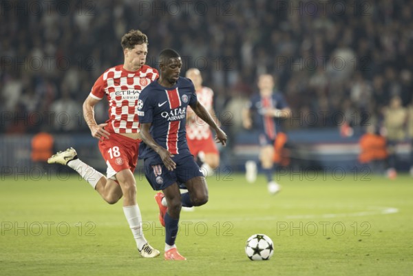 Football match, Ousmane DEMBELE Paris St. Germain right on the ball, Ladislav KREJCI Girona FC with puffed up cheeks follows him, Parc des Princes football stadium, Paris