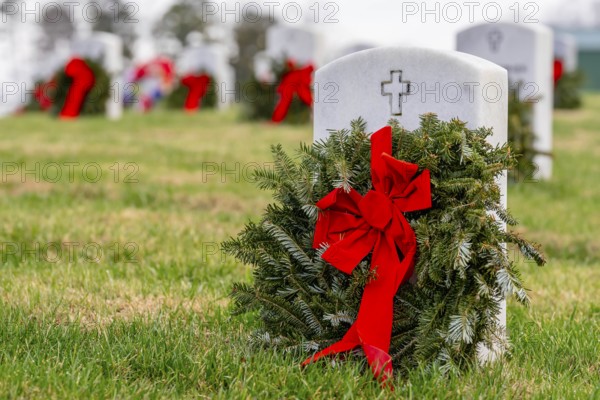 Atop a hill, a veterans cemetery with white headstones and the American flag evokes deep honour, sacrifice, and enduring national pride, Salisbury, United States of America